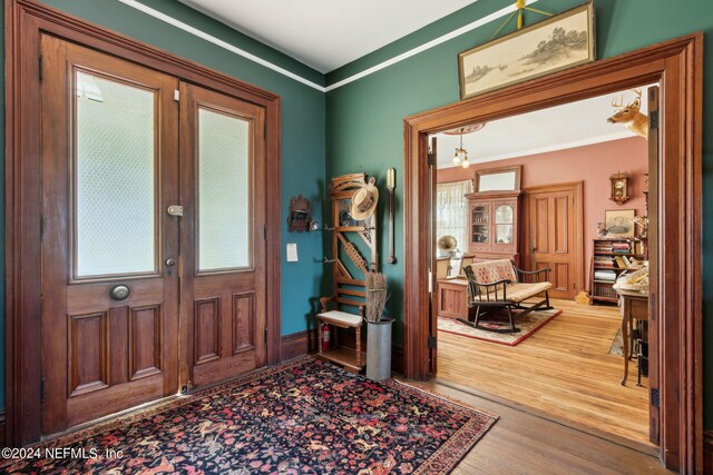 entryway with wood-type flooring