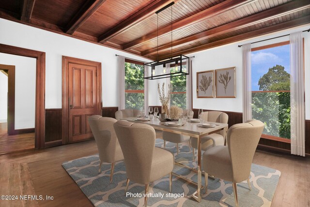 dining space featuring wood ceiling, beamed ceiling, and light hardwood / wood-style floors