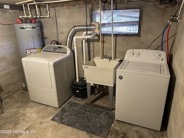 clothes washing area featuring sink, independent washer and dryer, and water heater