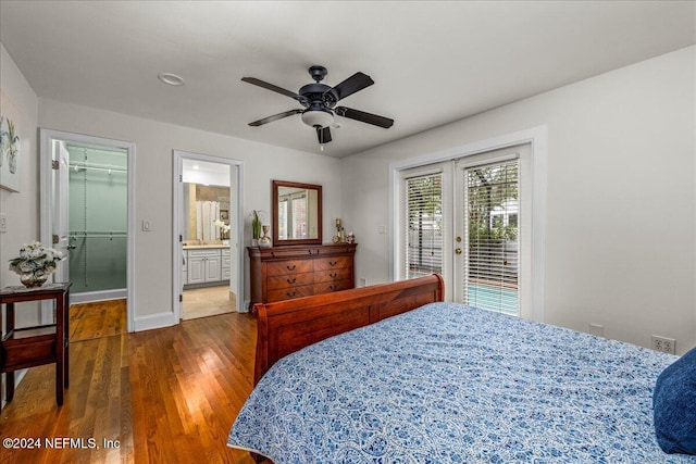 bedroom featuring ceiling fan, access to outside, a spacious closet, french doors, and hardwood / wood-style flooring