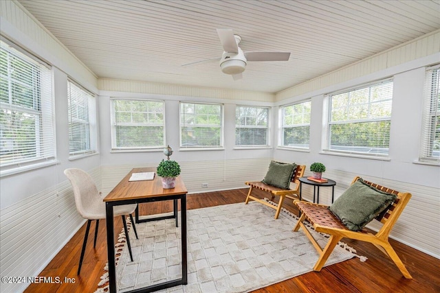 sunroom featuring ceiling fan