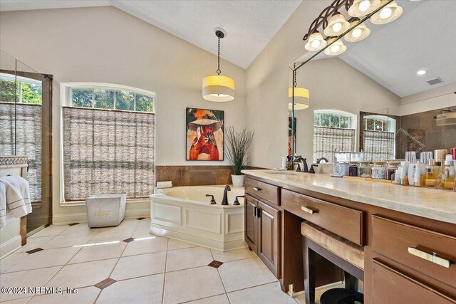 bathroom with tile patterned flooring, vanity, high vaulted ceiling, and a wealth of natural light