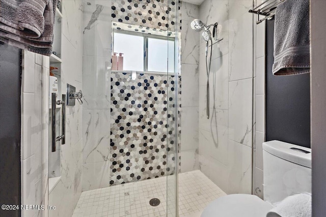 bathroom with walk in shower and toilet