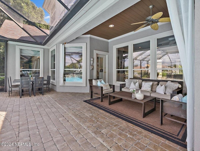 view of patio with a ceiling fan, outdoor dining area, and an outdoor living space