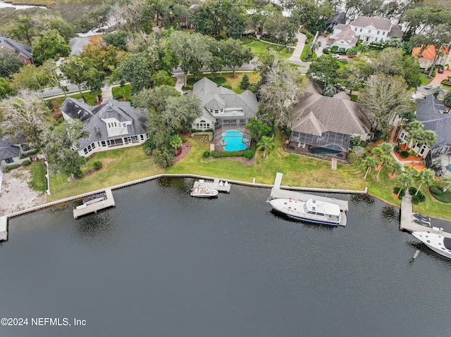 bird's eye view featuring a water view and a residential view