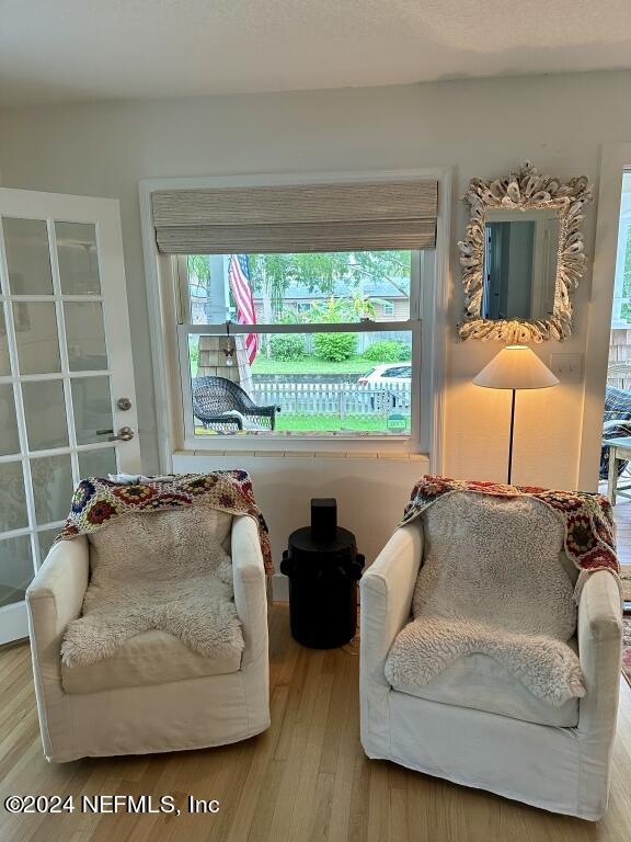 sitting room featuring hardwood / wood-style flooring