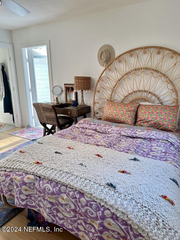 bedroom with ceiling fan and wood-type flooring