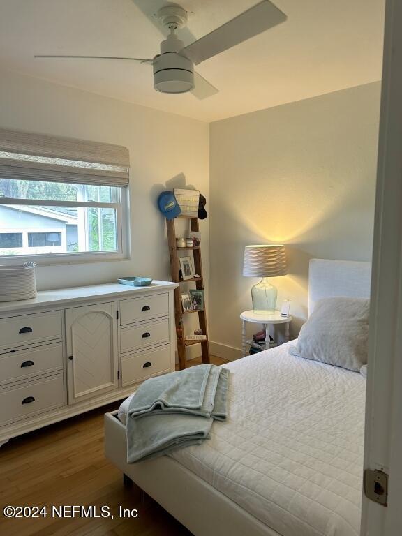 bedroom featuring ceiling fan and wood-type flooring