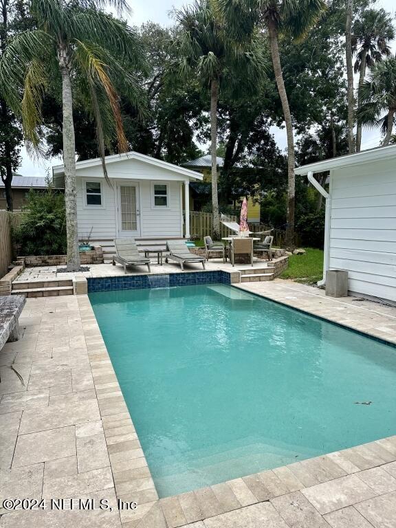 view of swimming pool featuring a patio