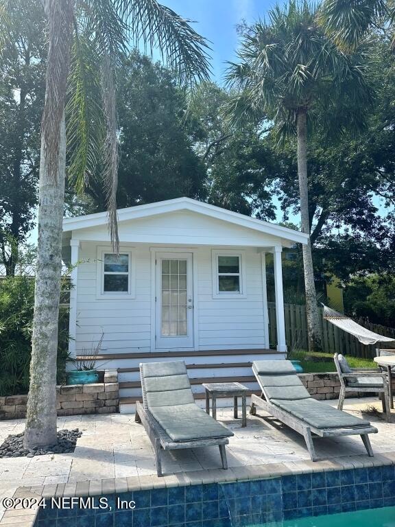 rear view of property with a patio area