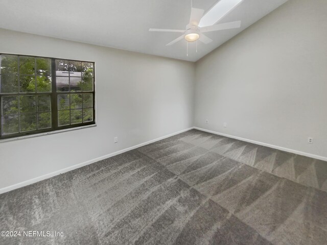 spare room featuring carpet and ceiling fan