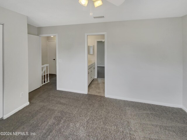 spare room with ceiling fan and carpet flooring