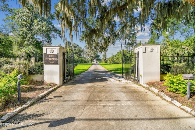 view of road featuring a gate