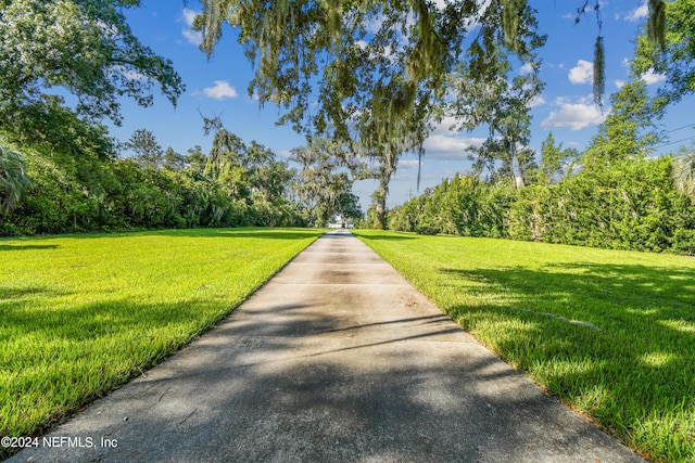 view of community featuring a lawn