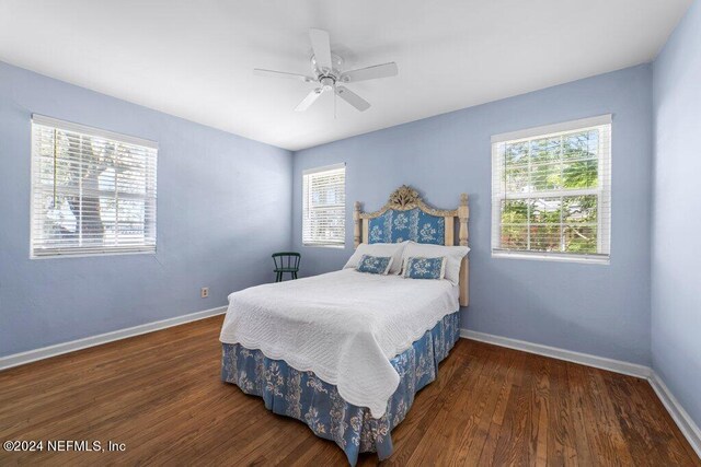 bedroom featuring ceiling fan and dark hardwood / wood-style floors