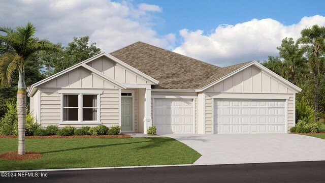 view of front facade with a front yard and a garage