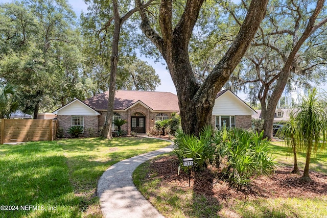 ranch-style house with a front yard