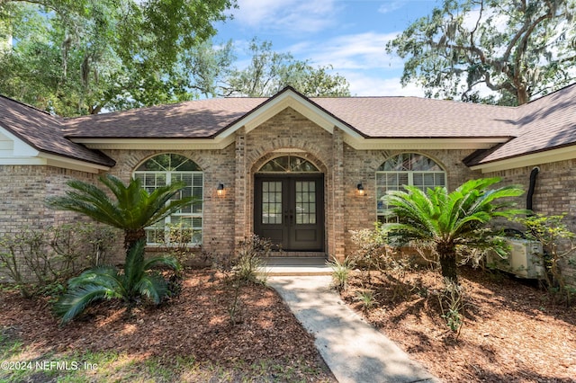 property entrance featuring french doors