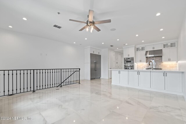 219 11th Ave S, Jacksonville Beach, FL 32250 - kitchen featuring a ceiling fan, under cabinet range hood, stainless steel appliances, visible vents, and white cabinets