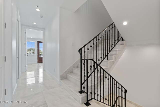 219 11th Ave S, Jacksonville Beach, FL 32250 - staircase with marble finish floor, baseboards, and recessed lighting