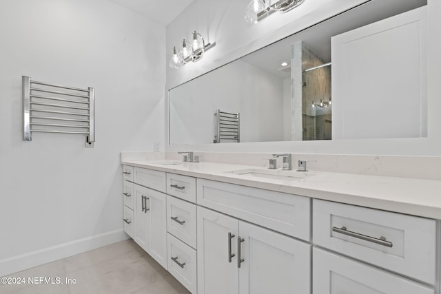 219 11th Ave S, Jacksonville Beach, FL 32250 - full bath featuring double vanity, a sink, radiator heating unit, and a stall shower