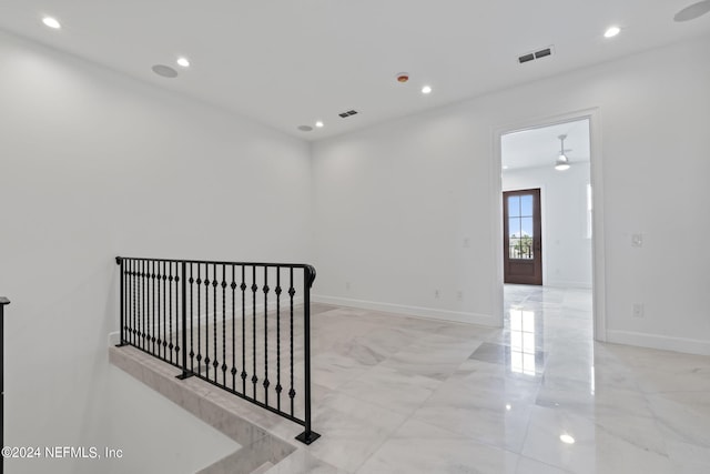 219 11th Ave S, Jacksonville Beach, FL 32250 - empty room featuring marble finish floor, baseboards, visible vents, and a ceiling fan