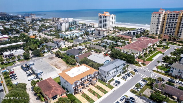 aerial view with a view of the beach and a water view