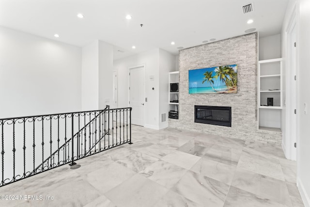219 11th Ave S, Jacksonville Beach, FL 32250 - interior space featuring a large fireplace, visible vents, recessed lighting, and built in shelves