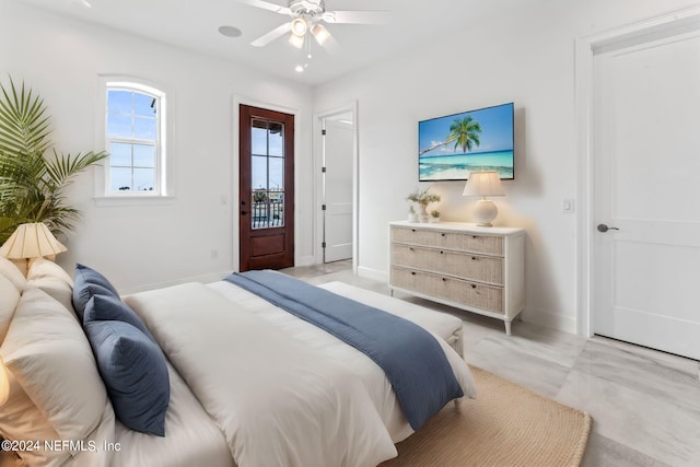 carpeted bedroom featuring ceiling fan and access to outside