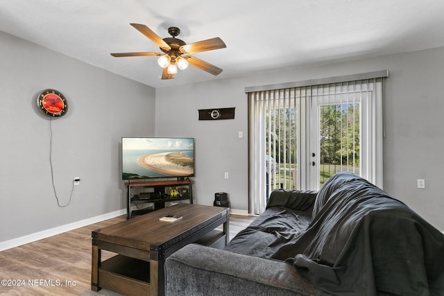 living room with ceiling fan, french doors, and wood-type flooring