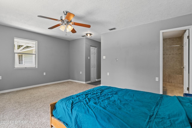 unfurnished bedroom featuring ceiling fan, carpet flooring, and a textured ceiling