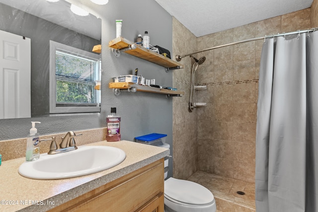 bathroom with a shower with shower curtain, toilet, and vanity