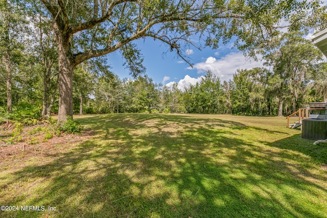 view of yard featuring central AC