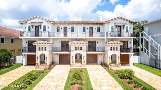 mediterranean / spanish house featuring a garage