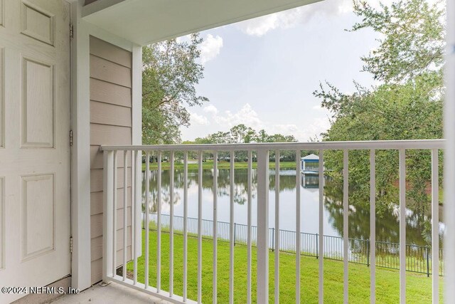 balcony featuring a water view