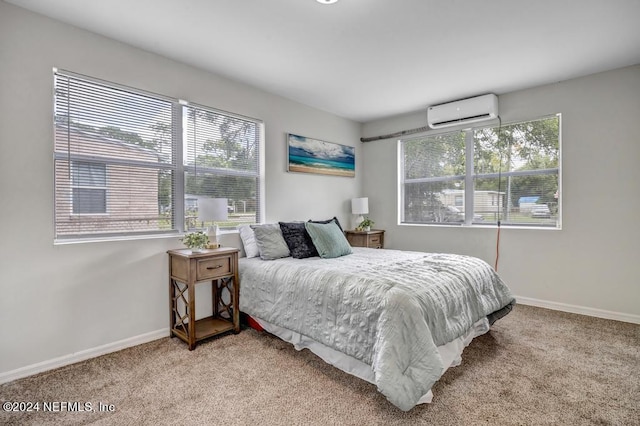 bedroom featuring light carpet, multiple windows, and a wall mounted air conditioner