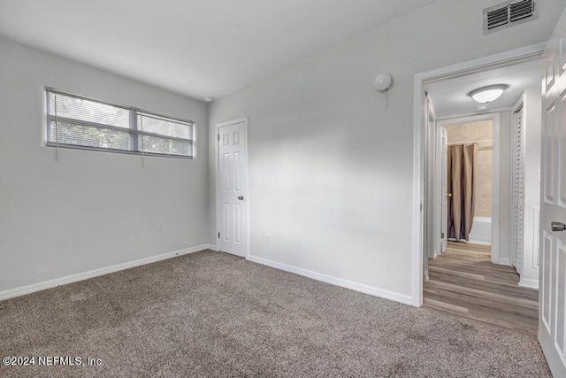 empty room featuring wood-type flooring