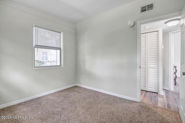 spare room with hardwood / wood-style floors