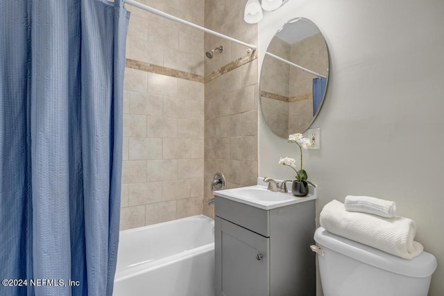 full bathroom featuring vanity, toilet, and shower / bath combination with curtain