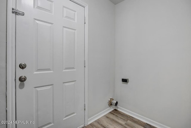 washroom with light wood-type flooring and electric dryer hookup