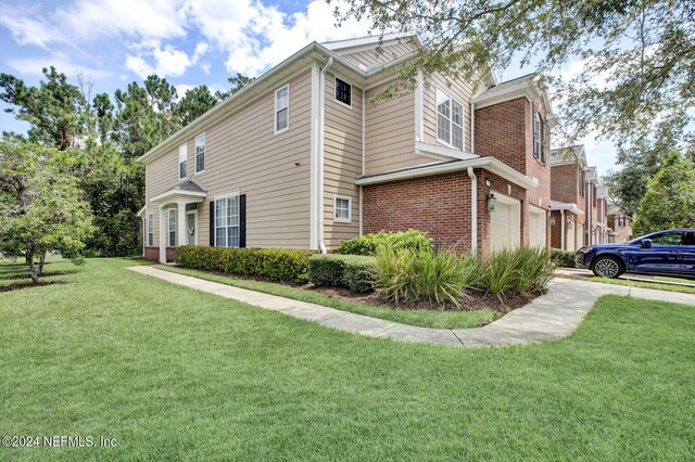 view of property exterior featuring a garage and a yard