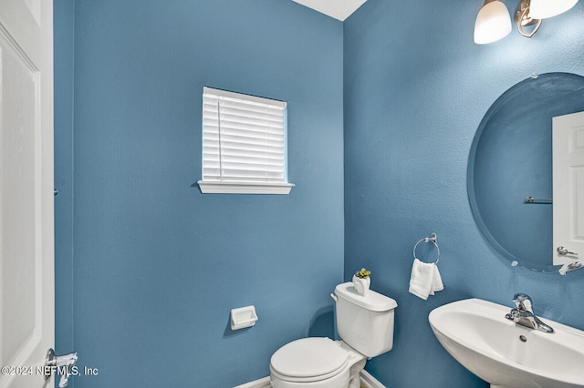 bathroom featuring sink and toilet