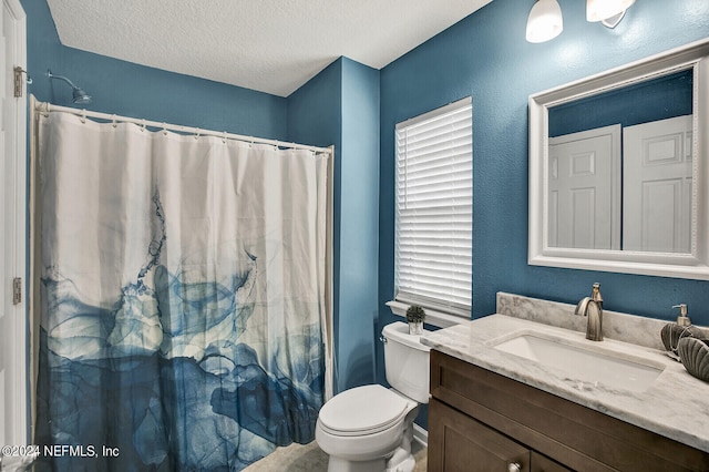 bathroom with a shower with shower curtain, toilet, a textured ceiling, and vanity