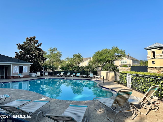 view of swimming pool featuring a patio