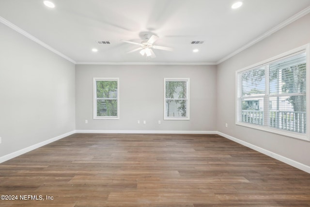 unfurnished room featuring baseboards, ornamental molding, visible vents, and a ceiling fan