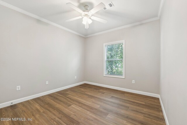 unfurnished room with baseboards, ornamental molding, wood finished floors, and a ceiling fan