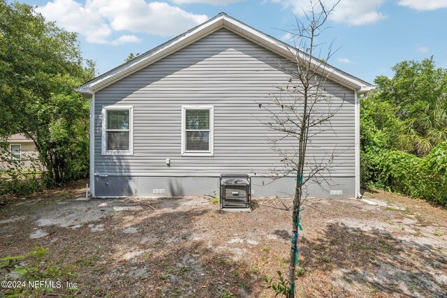 view of side of home with crawl space