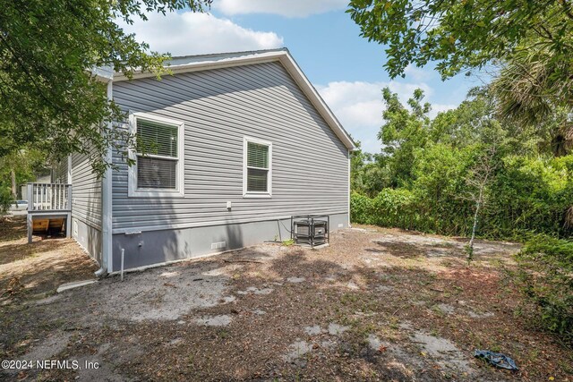 view of property exterior with crawl space