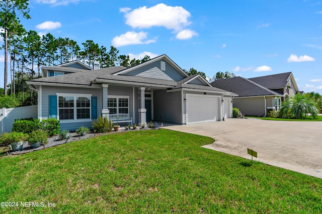 view of front facade with a front lawn and a garage