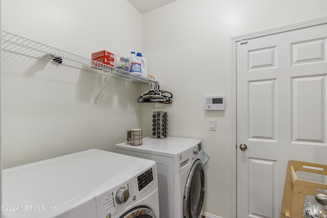 laundry area with laundry area and independent washer and dryer